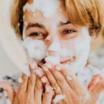 woman with a bubble face mask smiling